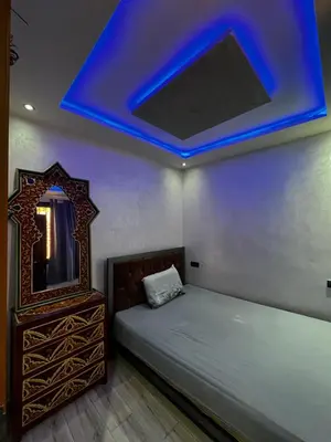 a bedroom with a bed and a blue ceiling at cozy studio in Kennaria, 1 min from Jemaa el-Fnaa in Marrakech