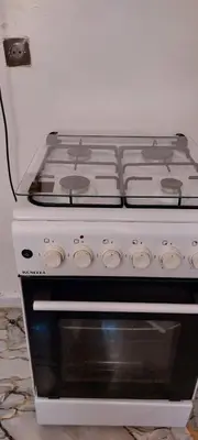 a white stove top oven sitting in a kitchen at Apartment near train station Marrakesh in Marrakech