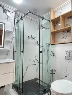 a bathroom with a shower and a toilet at Comfort Suites Marrakech in Marrakech
