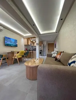 a living room with a couch and a table at Comfort Suites Marrakech in Marrakech