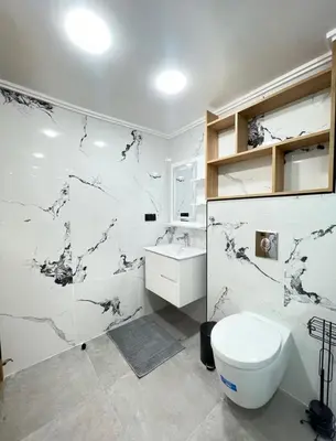 a bathroom with a toilet and a sink at Comfort Suites Marrakech in Marrakech