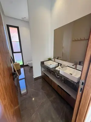 a bathroom with two sinks and a large mirror at Exceptional Villa Private Pool and Breakfast in Marrakech