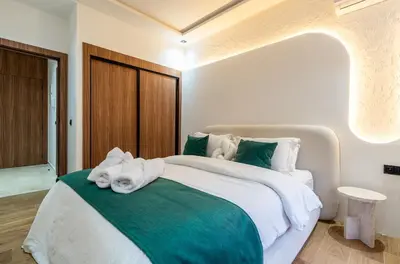 a bedroom with a large bed with towels on it at New! Maya House - Pool - Netflix - Gueliz in Marrakech
