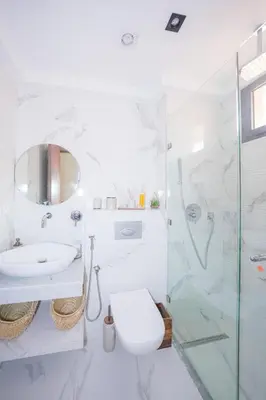 a bathroom with a toilet and a sink and a shower at Modern apartments, cozy residence, swimming pools in Marrakech