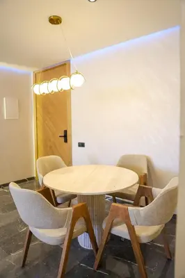 a conference room with a table and chairs at new modern elite II apartment in Marrakech