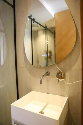 a bathroom with a sink and a mirror at new modern elite II apartment in Marrakech