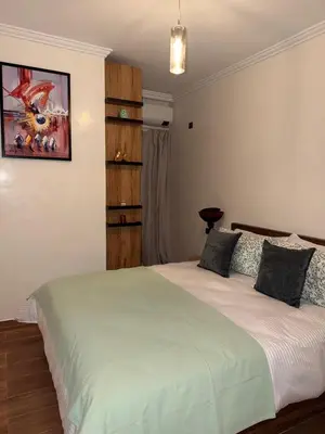 a bedroom with a large bed in a room at Appart Cosy et confort en plein centre Marrakech in Marrakech