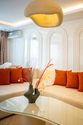 a living room with a couch and a glass table at Luxury Apartment In Majorelle Downtown Speed Wi-Fi and AC Calm in Marrakech
