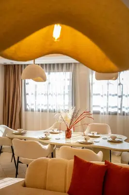 a dining room with a table and chairs at Luxury Apartment In Majorelle Downtown Speed Wi-Fi and AC Calm in Marrakech