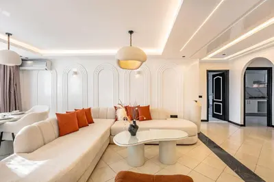 a living room with a couch and a table at Luxury Apartment In Majorelle Downtown Speed Wi-Fi and AC Calm in Marrakech