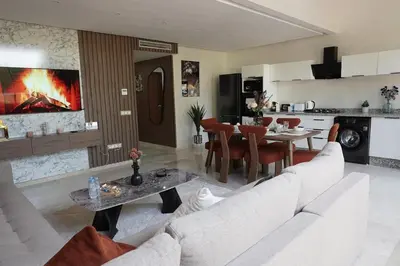 a living room with a white couch and a table at Mamounia loft by M&I in Marrakech