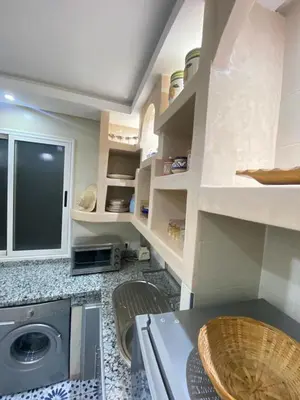 a kitchen with a washing machine in a room at Apartment in Marrakech Mabrouka in Marrakech