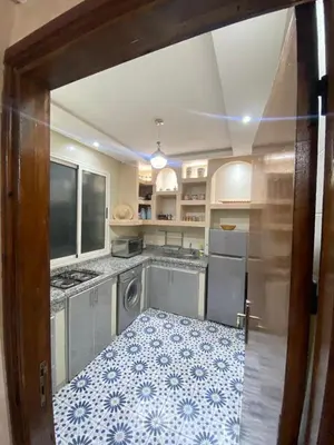a kitchen with a sink and a dishwasher at Apartment in Marrakech Mabrouka in Marrakech