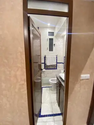 a bathroom with a shower and a toilet and a sink at Apartment in Marrakech Mabrouka in Marrakech