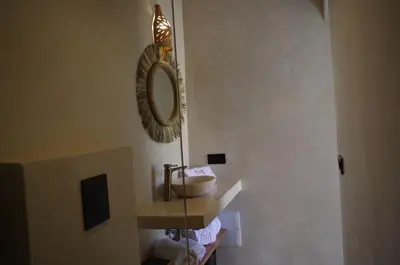 a bathroom with a sink and a mirror on the wall at Riad Casa Léa - Palais Bahia - Bassin & Pt Déj in Marrakech