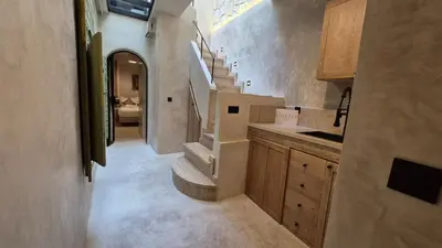 a bathroom with a sink and stairs in a room at Riad Casa Léa - Palais Bahia - Bassin & Pt Déj in Marrakech