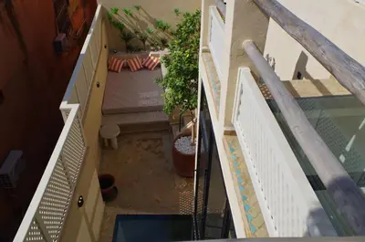 an overhead view of a balcony with a potted plant at Riad Casa Léa - Palais Bahia - Bassin & Pt Déj in Marrakech