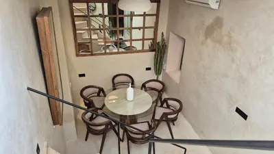 a dining room with a table and chairs at Riad Casa Léa - Palais Bahia - Bassin & Pt Déj in Marrakech