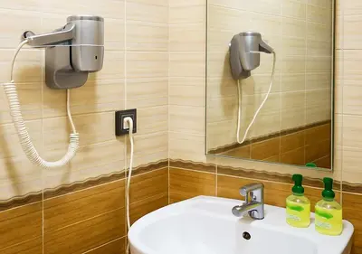 a bathroom with a sink and a mirror at Appart du centre 9 in Marrakech