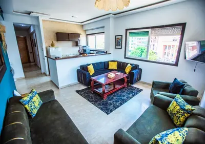 a living room with couches and a table at Appart du centre 9 in Marrakech