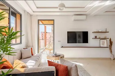 a living room with a couch and a tv at Rental unit in Marrakech in Marrakech