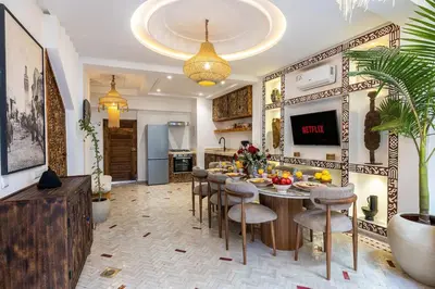 a kitchen with a table with fruits on it at Riad Tigmmi - Exclusive - Pool - Free BF - 10 pax in Marrakech