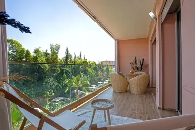 a room with a balcony with a view at Neuf, sûr et confortable Piscine familiale 10 mn de Guéliz in Marrakech