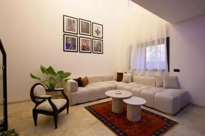 a living room with a couch and a table at Modern Oasis in Heart of Guéliz Pool Balcony in Marrakech