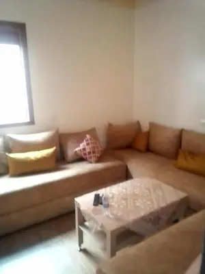 a living room with a couch and a coffee table at Marrakech in Marrakech