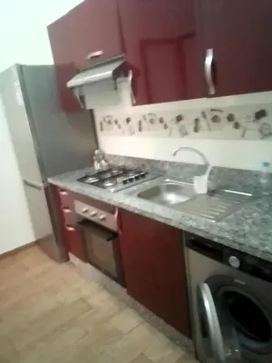 a kitchen with a sink and a washing machine at Marrakech in Marrakech