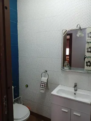 a bathroom with a sink and a toilet and a mirror at Marrakech in Marrakech