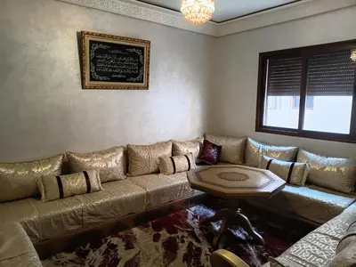 a living room with a couch and a table at Marrakech in Marrakech