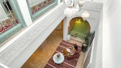 an overhead view of a living room with a table at Riad Tamazy in Marrakech