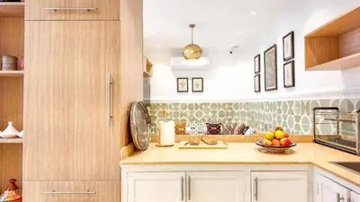 a kitchen with a bowl of fruit on a counter at Riad Tamazy in Marrakech