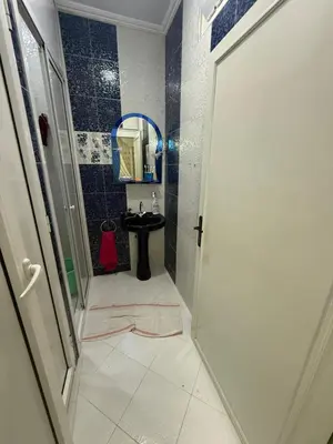 a bathroom with a sink and a mirror at Yassine in Marrakech