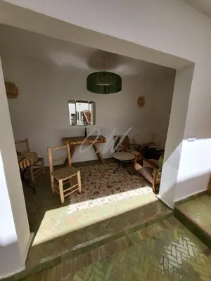 a view of a room with chairs and a table at Riad in Marrakech