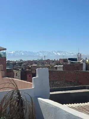 a view of a city from the roof of a building at Riad in Marrakech