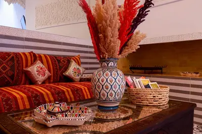 a vase sitting on a table in a living room at Riad Allal in Marrakech