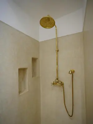 a shower with a shower head in a bathroom at Riad privatif Les Tamaris in Marrakech