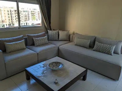 a living room with a couch and a coffee table at Rooftop apartment with large terrace in Guéliz in Marrakech