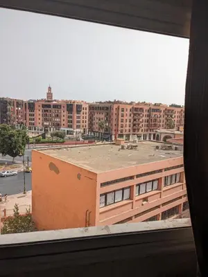 a view of a city from a window at Rooftop apartment with large terrace in Guéliz in Marrakech