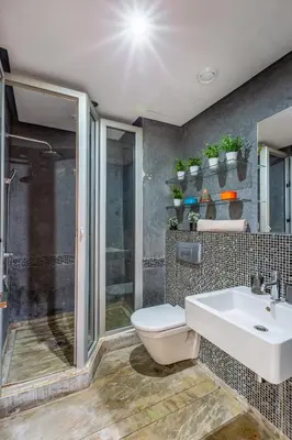 a bathroom with a toilet and a sink and a shower at superbe appartement au coeur de guiliz - victor Hugo in Marrakech