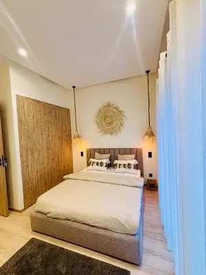 a bedroom with a large bed in a room at Villa MYSK in Marrakech
