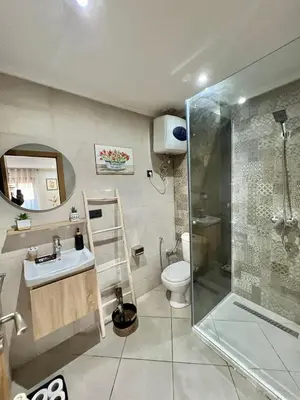 a bathroom with a shower and a sink and a toilet at New! Apartment F2 Gueliz Station Balcony renovated in Marrakech