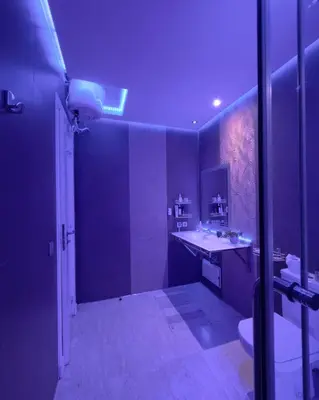 a purple bathroom with a sink and a toilet at Apartment gueliz in Marrakech