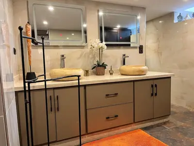 a bathroom with two sinks and a mirror at Loft Harmonia in Marrakech