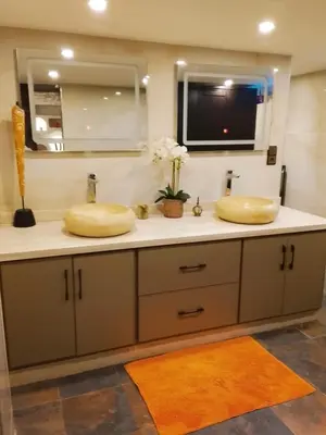 a bathroom with two sinks and a mirror at Loft Harmonia in Marrakech