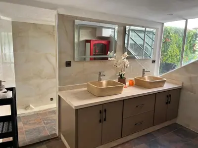 a bathroom with two sinks and a shower at Loft Harmonia in Marrakech