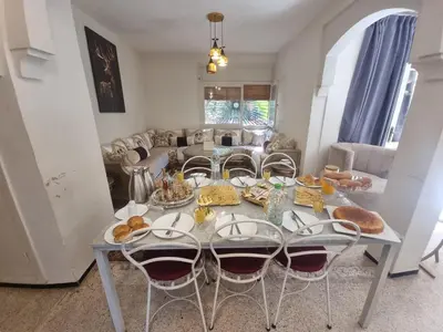 a living room with a table with food on it at Villa Victor Hugo in Marrakech