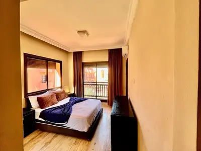 a hotel room with a bed and a window at City zen gueliz 1BR apartment in Marrakech